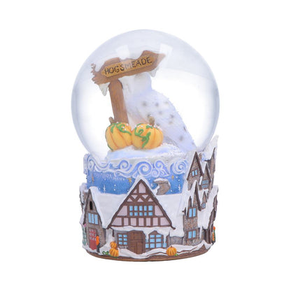 Harry Potter Hogsmeade Village snow globe by Nemesis Now, featuring detailed miniature scene inside a glass globe.