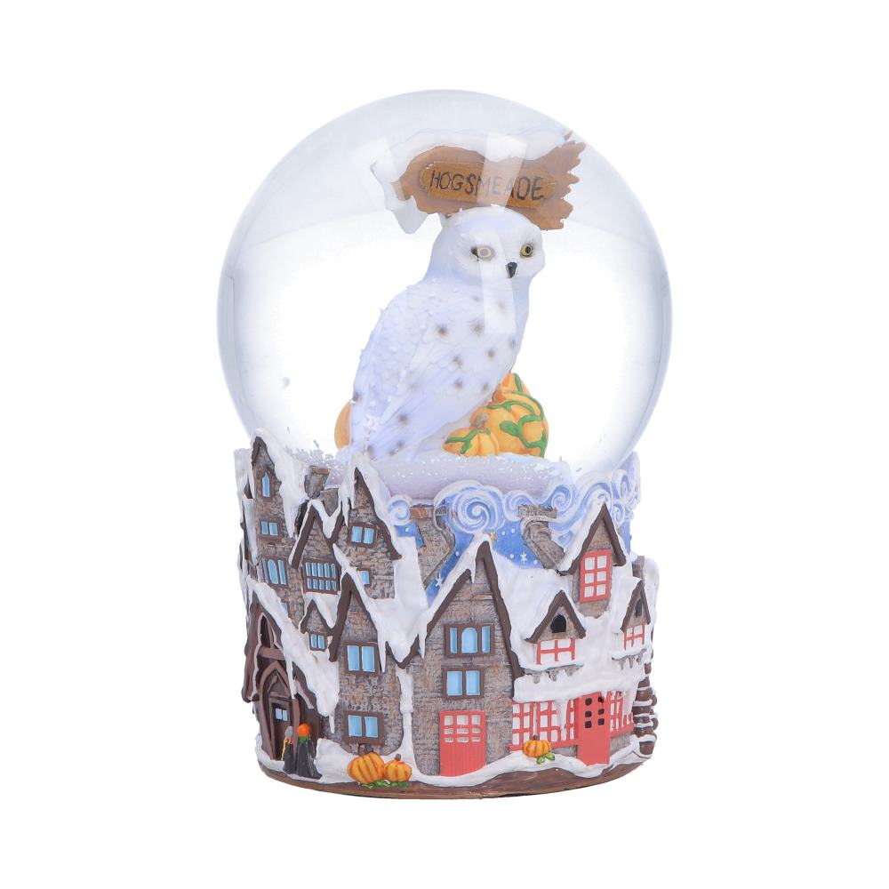 Harry Potter Hogsmeade Village snow globe by Nemesis Now, featuring a detailed miniature village scene inside a glass globe.