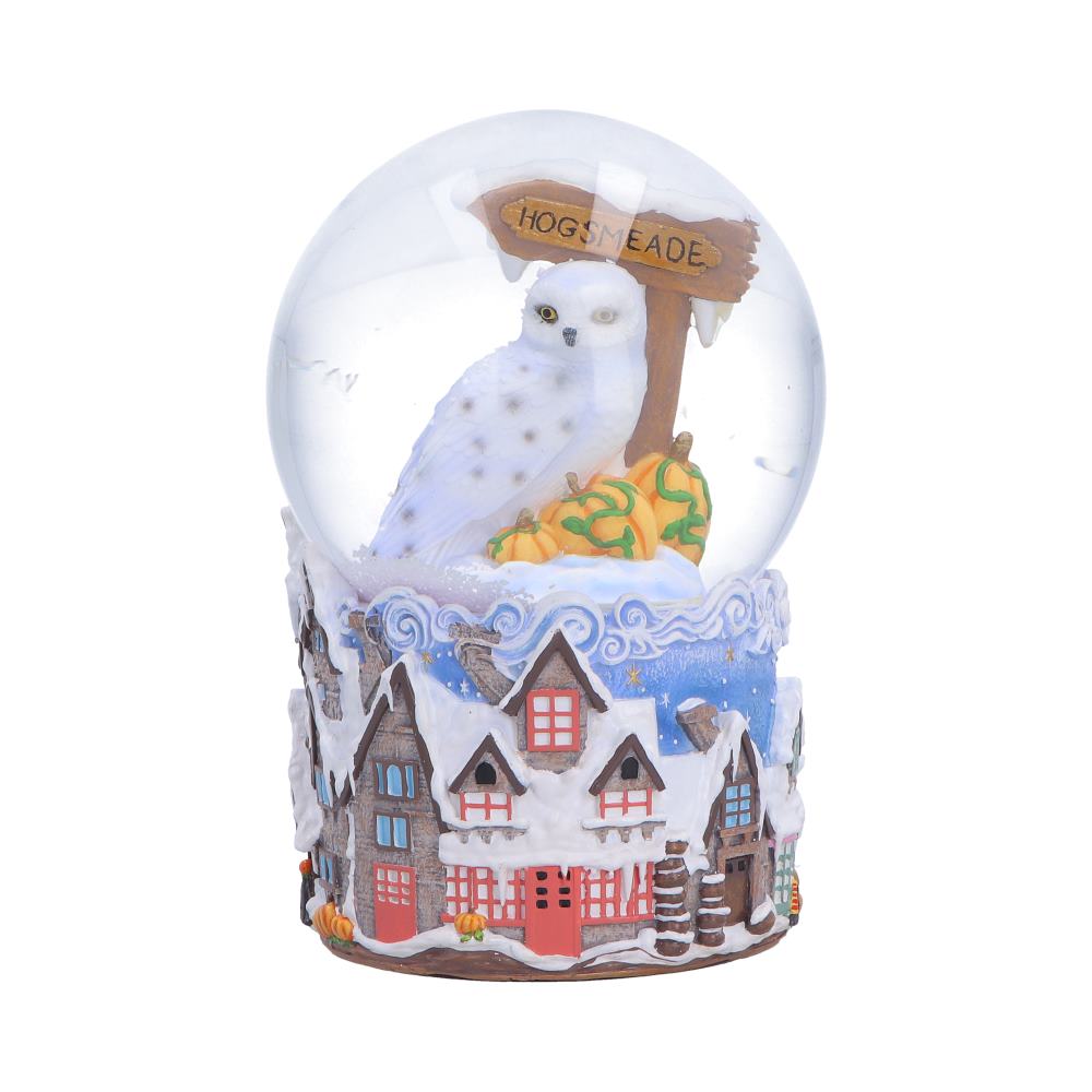 Harry Potter Hogsmeade Village snow globe by Nemesis Now featuring detailed village scene inside a 14.6cm glass globe