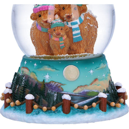 Winter Highland Cow snow globe by Nemesis Now featuring a Highland cow figurine inside a glass globe, 13.7cm tall.