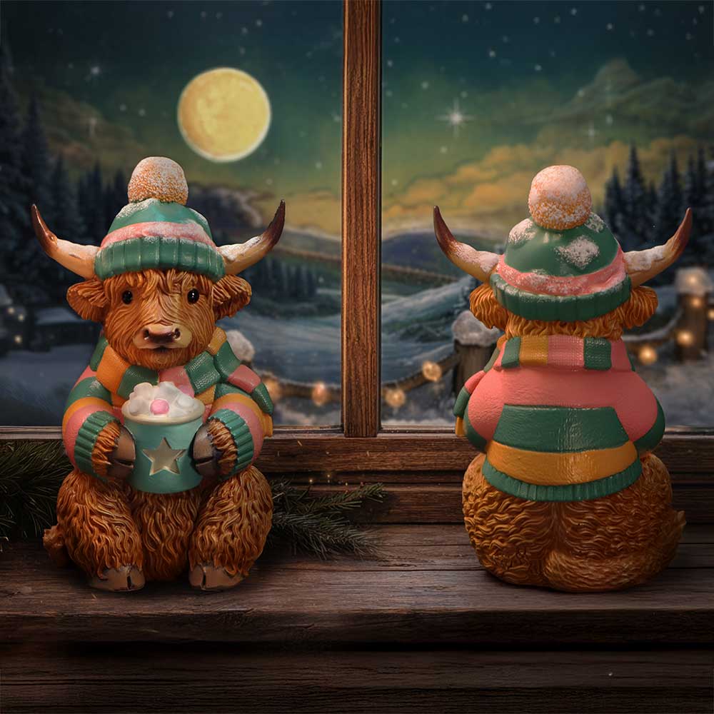 Nemesis Now Winter Highland Cow hot cocoa figurine, 12.3cm, detailed ceramic sculpture with festive winter design.