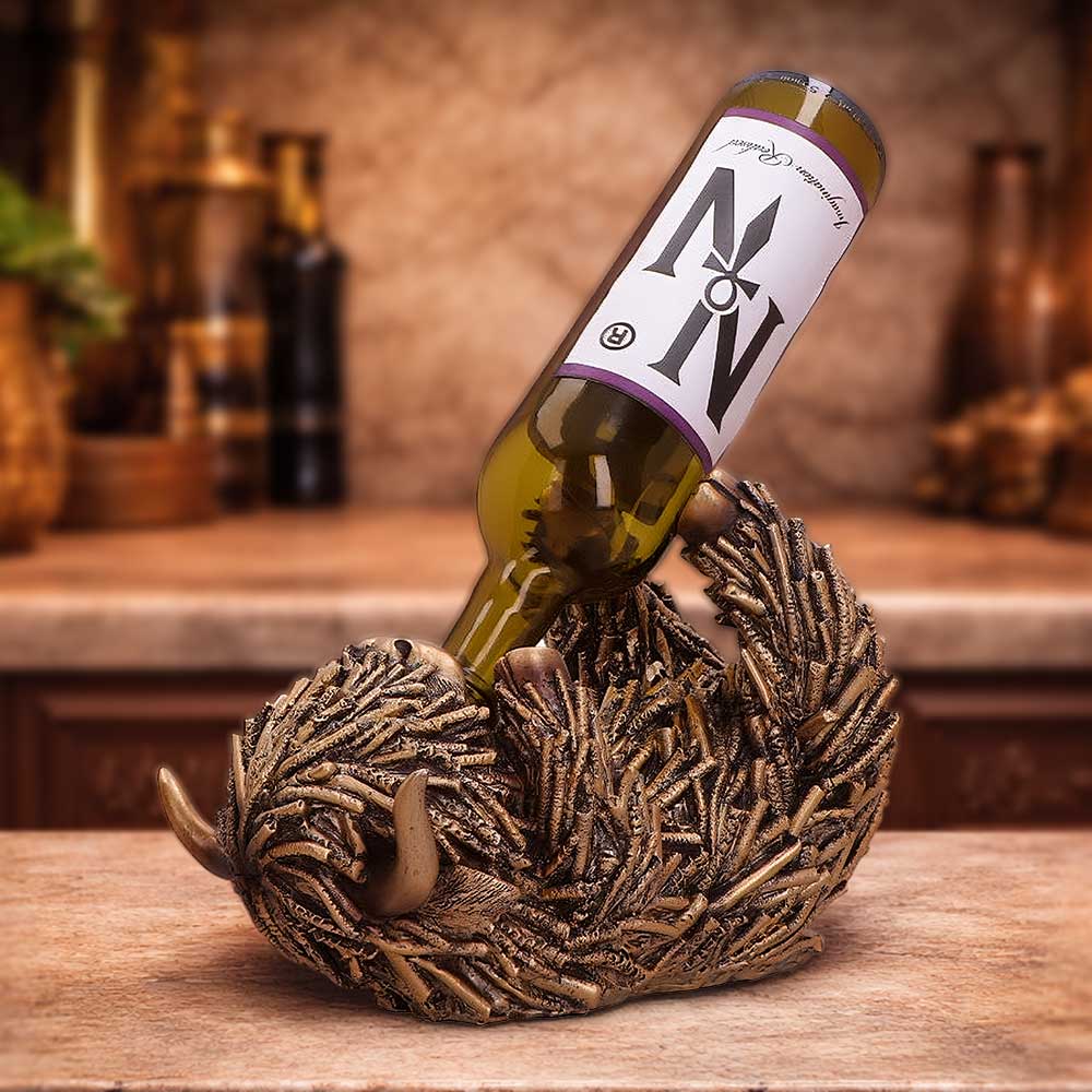 Gold Highland Cow Guzzler figurine by Nemesis Now, 17.8cm tall, featuring a detailed gold-colored Highland cow design.