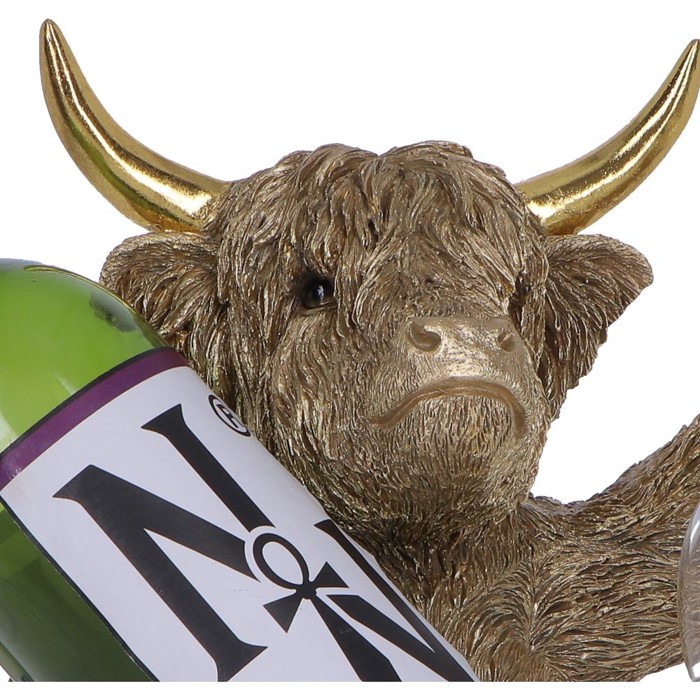 Gold Highland Cow wine bottle holder by Nemesis Now, 26.8cm tall, featuring a detailed highland cow design holding a wine bottle.