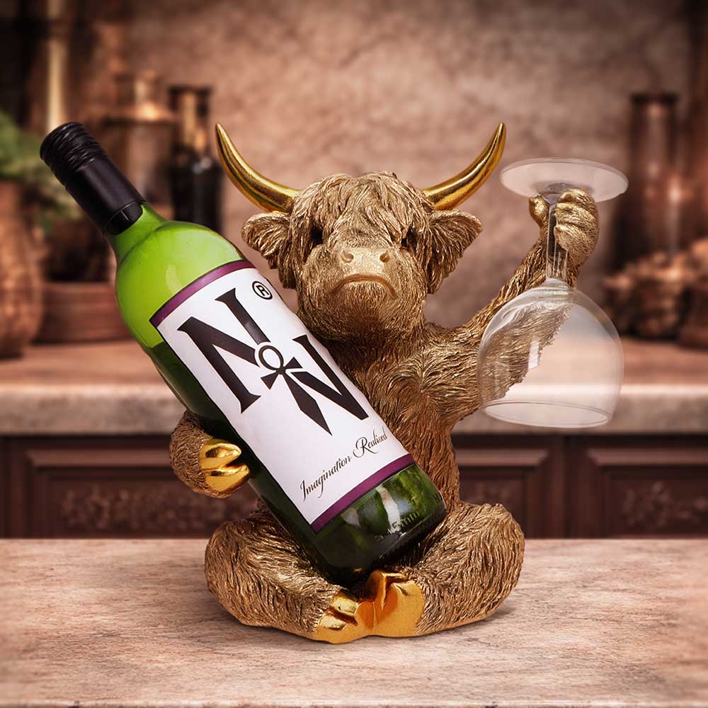 Gold Highland Cow wine bottle holder by Nemesis Now, 26.8cm tall, featuring a detailed Highland cow design perfect for wine storage.